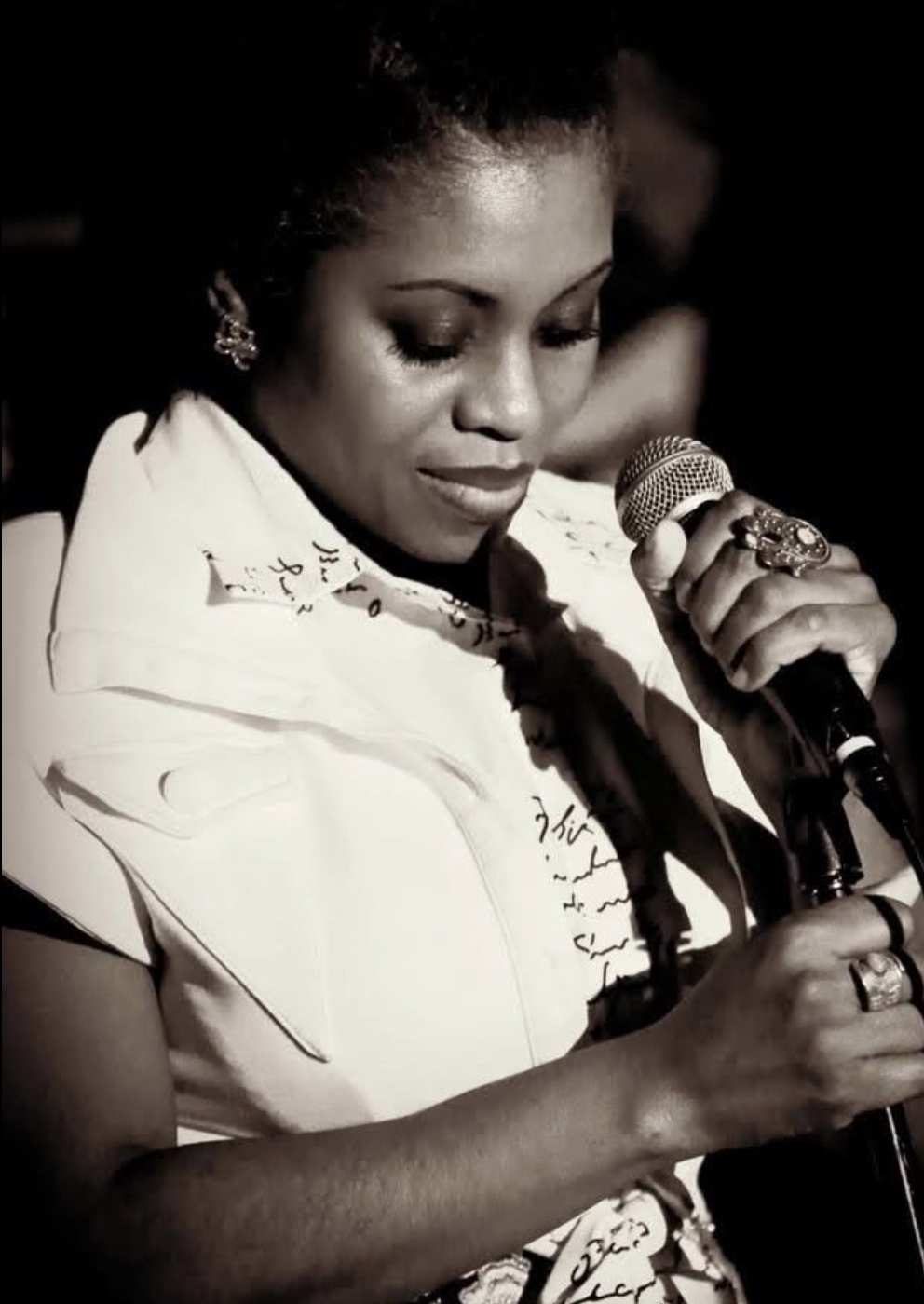 Jayme Alilaw speaking into a microphone