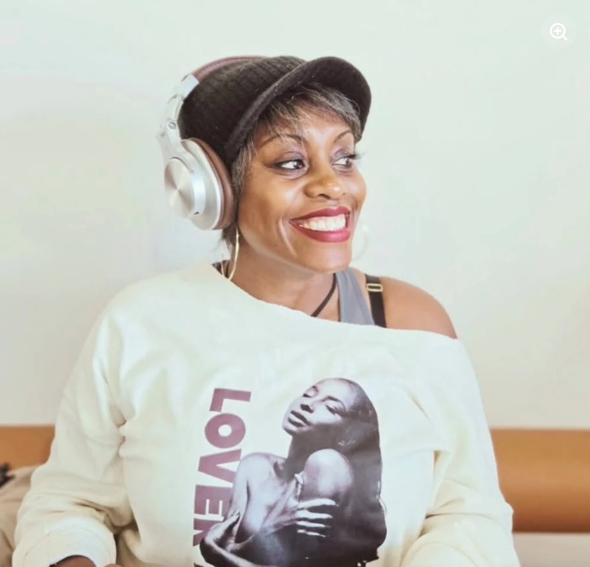 Jayme Alilaw smiling, wearing headphones